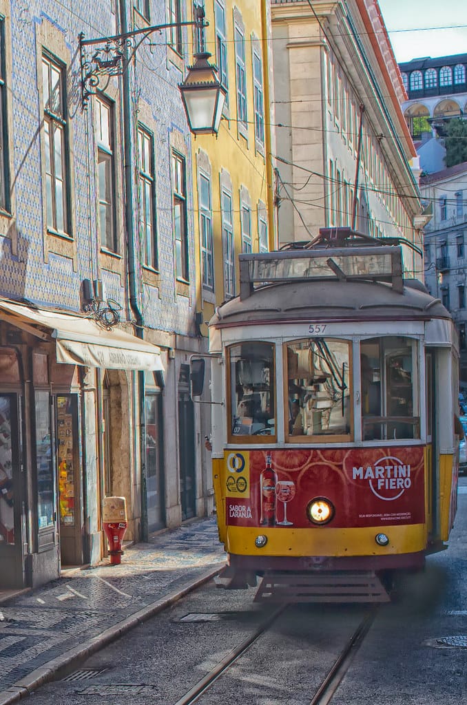 Tram 28 climbing a narrow street in Lisbon